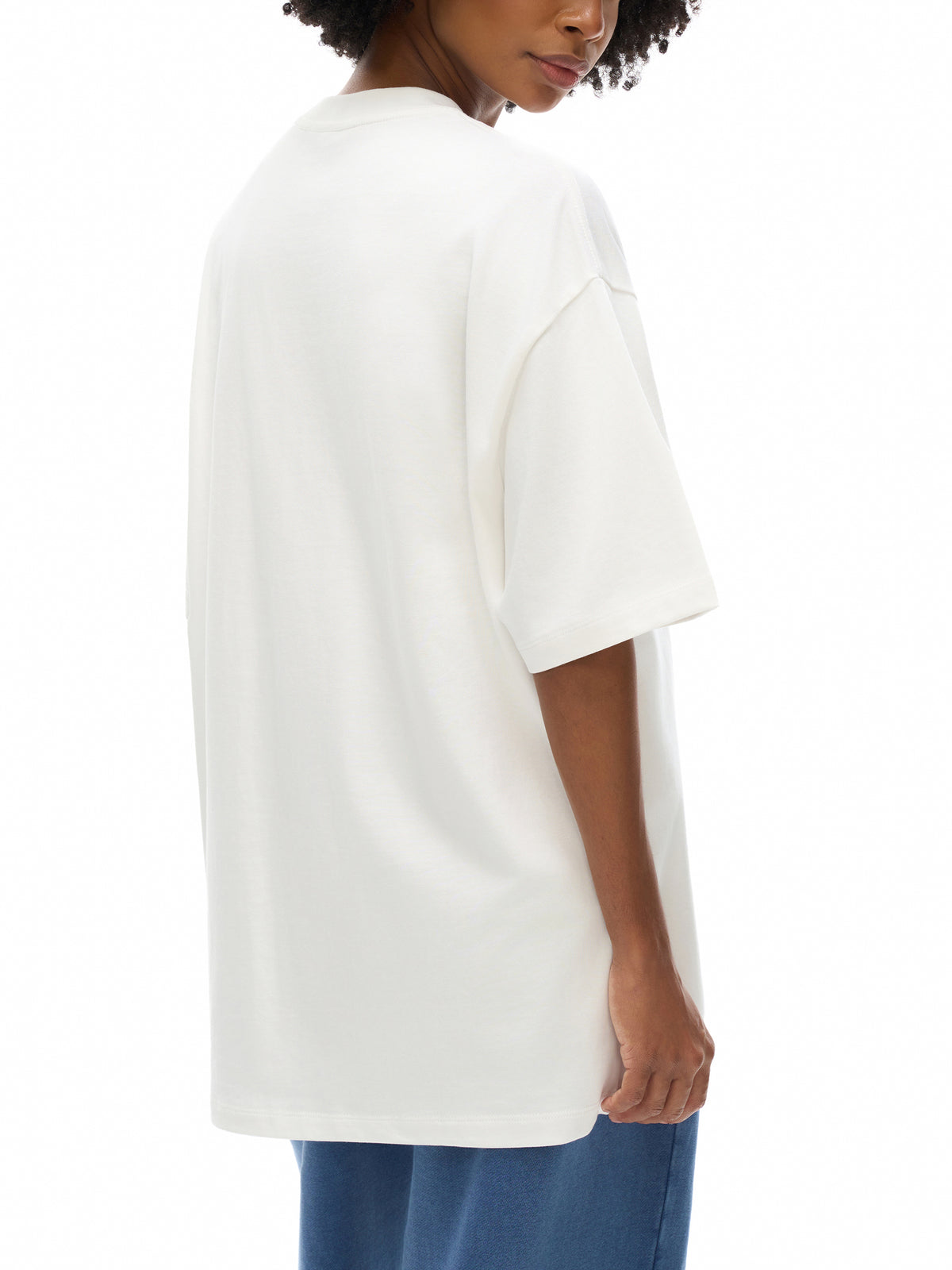Unisex heavyweight Earth Tone T-shirt in White – rear three-quarter model view