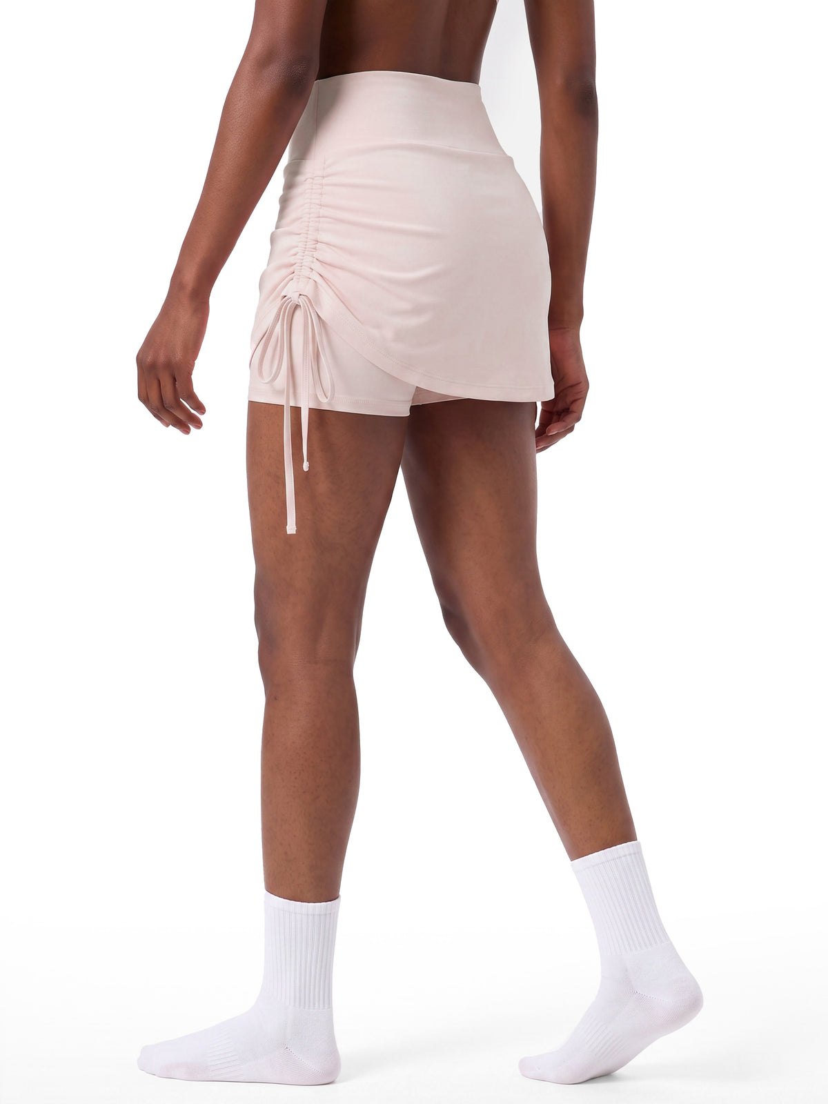 Women’s Drawstring A-Line Yoga Skort light pink model angled back view